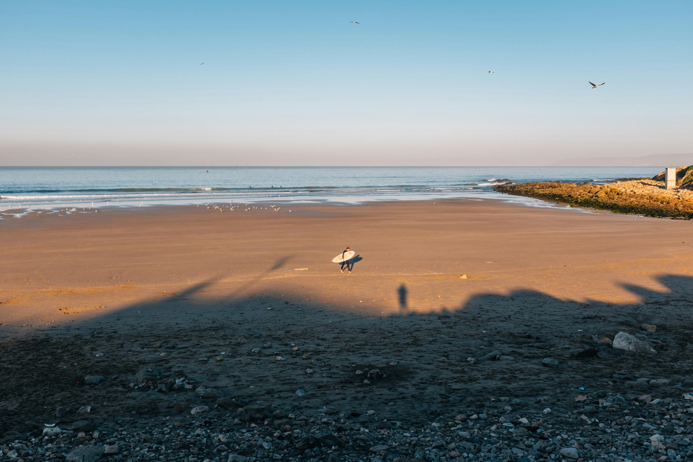 Beginner surf lesson on a sandy beach in Morocco